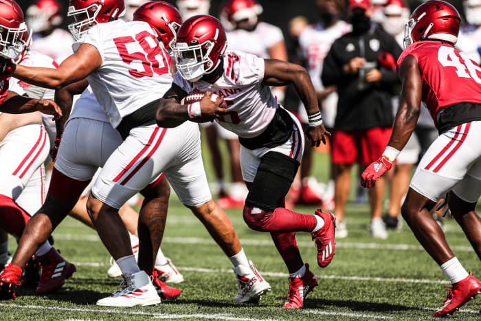 Indiana sophomore running back Sampson James carries the ball during Indiana's fall practice on Aug. 9.